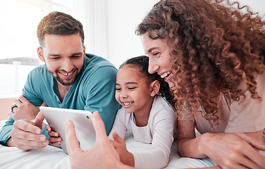 Image showing Happy, bed and family with a tablet, comic and connection for social media, funny videos or quality time. Parents, mother and father with daughter, bedroom and female child with device or interracial