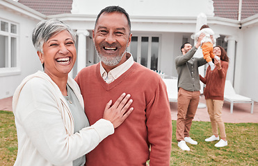 Image showing Happy, outdoor and portrait of senior couple standing in the yard of their modern family home. Happiness, smile and elderly man and woman in retirement with their children and grandchild by the house