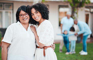 Image showing Mother, daughter and family hug outside a home or house feeling happy and excited together and bonding. Love, care and people embrace for support, hugging and bonding for happiness or unity