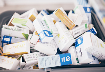 Image showing Closeup of medicine, boxes and shopping in pharmacy, drugstore service and consumer market. Retail dispensary, pharmaceutical stock and basket of pills, supplements and products of medical tablets