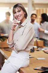 Image showing Portrait, meeting and boardroom with a business woman in the office for planning, strategy or management. Training, seminar and smile with a happy female employee sitting on a table during a workshop