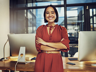 Image showing Portrait, smile and late with a business woman in her office, arms crossed while working in the evening at night. Vision, happy and dark with an asian female employee standing at work for dedication
