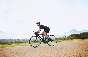 Image showing Cycling, training and fitness with woman in nature and mockup for race, workout and challenge. Exercise, workout and travel with female cyclist riding on bike for journey, adventure and cardio