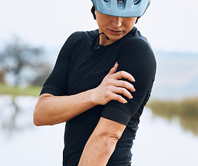 Image showing Cycling, injury and woman arm with problem, issue or inflammation after fitness workout in nature. Shoulder pain, girl and cyclist with muscle, joint or bone arthritis, fibromyalgia or osteoporosis