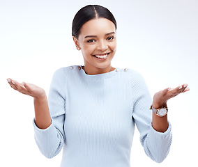 Image showing Portrait, smile and woman shrugging in studio for decision, unsure and deciding against white background. Face, emoji and happy female with hands expression for dont know, choice or mockup reaction