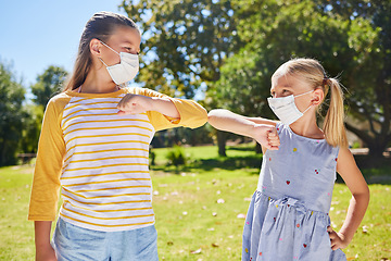 Image showing Elbow greeting, covid and kids outdoor together for social distance, prevention or safety. Girls, park and friends bump elbows with children in face mask for hello and solidarity at school in summer
