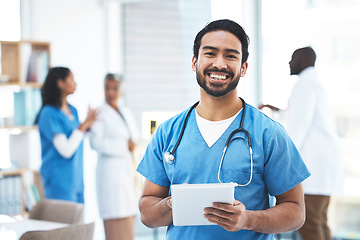 Image showing Portrait, doctor and Asian man with tablet, typing and smile with confidence, career or online reading. Face, male surgeon or medical professional with device, technology for healthcare or research