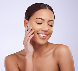 Image showing Woman, clean beauty and skincare in a studio with happiness and smile from dermatology. Skin glow, facial and cosmetics of a young female model feeling happy from self care and face wellness