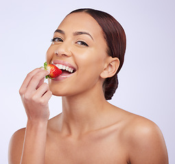 Image showing Woman, skincare and studio portrait with strawberry for self care, diet or beauty with benefits for glow on face. Girl, model and fruit for eating with wellness, health and dermatology by background