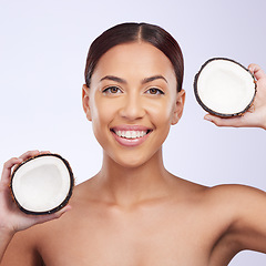 Image showing Woman, coconut and studio portrait with smile for self care, skincare or beauty with natural benefits for face. Girl, model and fruit for skin wellness, cosmetic health and dermatology by background