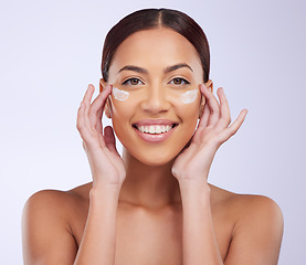 Image showing Beauty, skincare or happy woman with sunscreen product in daily grooming treatment with makeup cosmetics. Dermatology, white background or girl model smiling or applying facial cream lotion in studio