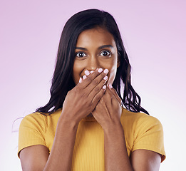 Image showing Happy, portrait and a woman quiet with a secret isolated on a studio background. Silence, shy and a girl covering mouth with hands for gossip, shock and surprise on a backdrop for embarrassment