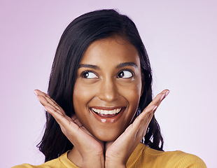 Image showing Excited, beauty and face of happy Indian woman on pink background with smile, cosmetics and surprise. Happiness, fashion and girl pose with hands in studio for promotion, announcement and good news