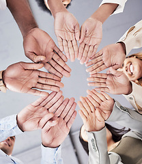 Image showing Hands, circle and together in low angle for business people with teamwork, motivation and solidarity in office. Women, happiness and open palm with smile, team building and support for company goals