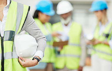 Image showing Industry, hardhat and closeup of a woman construction worker with safety equipment or gear. Builder, professional and zoom of a female industrial foreman worker with her building team on a site.