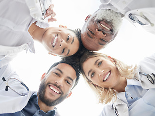 Image showing Below portrait, doctors and circle in team building closeup for motivation, success and diversity. Doctor, teamwork and excited face with solidarity, support or collaboration for healthcare in clinic