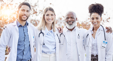 Image showing Doctors, hug together and group portrait for motivation, success or team building at hospital. Men, women and teamwork with solidarity, support or diversity in healthcare, goals and friends at clinic