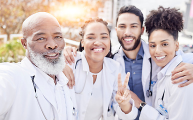 Image showing Selfie, peace and collaboration with a team of doctors posing outdoor together while working at a hospital. Profile picture, healthcare and medical with a group of friends taking a photograph outside