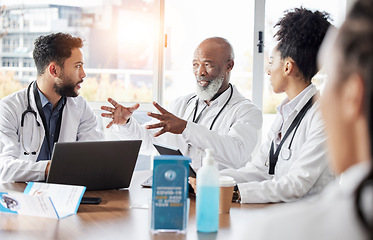 Image showing Medical team, meeting and doctor speaker in a hospital conference room for healthcare seminar. Collaboration, teamwork and wellness staff in a conversation for doctors innovation and management