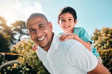 Image showing Portrait, piggyback and a boy flying on the shoulders of his father outdoor in the garden while bonding together. Family, children or love and a son playing with his dad in the backyard of their home