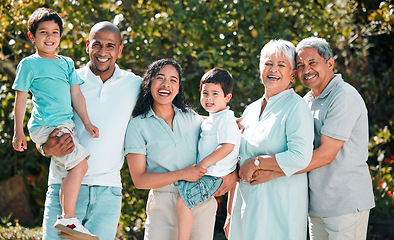 Image showing Parents, grandparents and children portrait outdoor as family in backyard with a smile, love and care. Men, women and boy kids together for security, hug and quality time with happiness at park