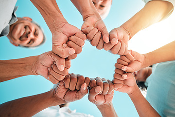 Image showing Fist, hands circle and below group of family, men and women for support, motivation or love. People, happy and hand together with solidarity, bonding or outdoor with sky, smile and vacation in summer