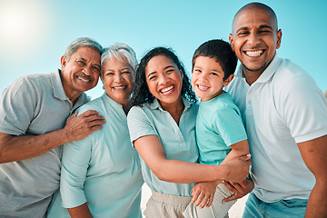 Image showing Family, portrait and happy outdoor at beach with a smile, happiness and care together on vacation. Smile of parents, grandparents and boy kid or men and women on holiday with summer sky to relax