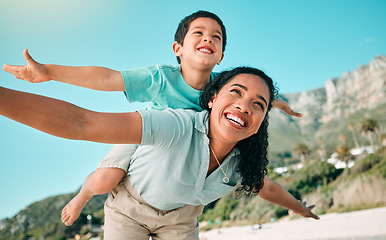 Image showing Mother, child and family outdoor at beach playing airplane game for fun. Happy woman and boy kid play and laughing for happiness, freedom and adventure on travel holiday or vacation with love outdoor