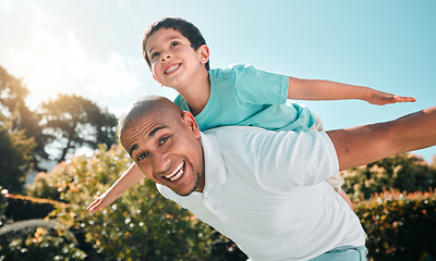 Image showing Portrait, piggyback and a boy flying on the back of his father outdoor in the garden while bonding together. Family, children or love and a son playing with his dad in the backyard of their home