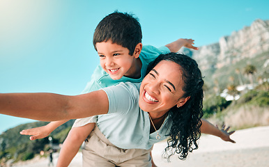 Image showing Child, mother or happy family outdoor at beach playing airplane game for fun. Young woman and boy kid play for happiness, freedom and adventure on a travel holiday or vacation with love outdoor