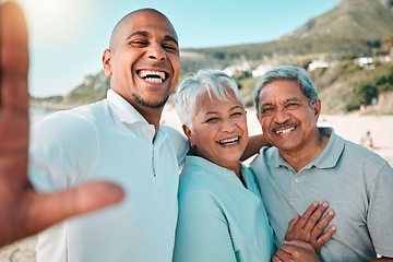 Image showing Senior parents, son and beach selfie with smile, hug and happiness in summer sunshine for social media. Woman, men and portrait with happy, excited face or profile picture with love on family holiday