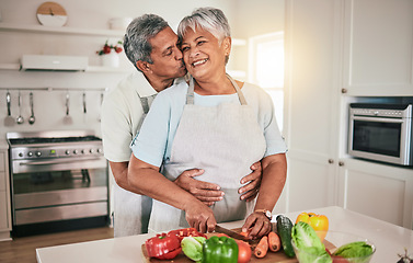 Image showing Cooking vegetables, hug and elderly couple with kitchen ingredients, prepare food or smile on romantic home date. Nutritionist, marriage love and hungry man, woman or people bonding over healthy meal