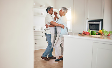 Image showing Happy, cooking or elderly couple dance in the kitchen together and feeling love, excited and bonding in home. Care, happiness or romantic old people or lovers dancing and enjoying retirement in house