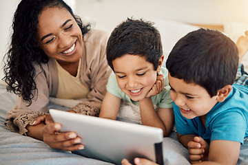 Image showing Tablet, education and a woman with her children on a bed at home in the morning together for entertainment. Family, boy or brother with a mother and her kids learning online in the bedroom of a house