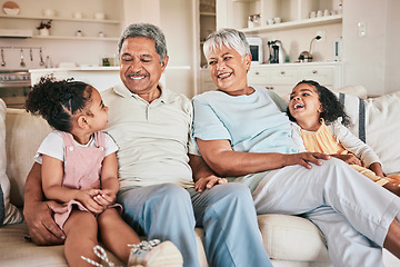 Image showing Family, grandparents and kids laughing at home with love, care and bonding together on relax sofa. Happiness, children and people laugh at funny joke, relationship or spending quality time on weekend