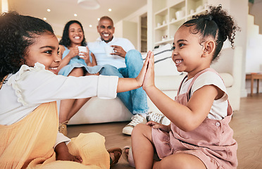 Image showing Family, high five and children playing, smile and having fun in a living room. Kids, hands and games with parents bonding in their home, cheerful and relaxing, smiling and enjoying happy childhood