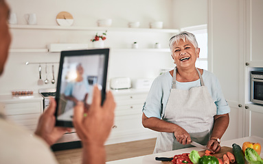 Image showing Cooking food, elderly couple and tablet photo of senior woman, wife or person with digital memory picture. Vegetables nutritionist, photography shooting and laughing people bonding in health kitchen