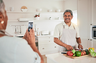 Image showing Kitchen cooking, elderly couple or phone photo of senior man, husband or nutritionist person with memory picture. Vegan food, love or people bonding, happy or prepare vegetables ingredients for lunch