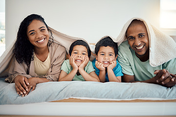 Image showing Happy family, morning bed portrait and relax mother, father and children smiling, home bonding and enjoy time quality together. Comfort, love smile and cozy man, woman and youth kids lying in bedroom