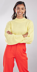 Image showing Fashion, portrait and woman model in studio with a stylish, trendy and classy elegant outfit. Smile, style and young Indian female posing with crossed arms for confidence isolated by gray background.