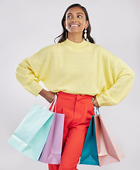 Image showing Shopping bags, fashion sale and happy woman in a studio with a customer, gift and sales bag. Isolated, white background and store packaging from a boutique present or mall retail shop with a female