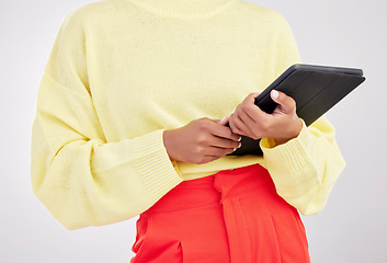 Image showing Technology, studio and hands of woman with tablet for research, communication and networking. White background, contact and female with digital tech for social media, internet website and mobile app