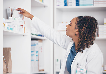 Image showing Woman, drugs and pharmacist in pharmacy with supplements, healthcare and medicine in drug store. Vitamins, pills and female search for prescription medication with stock and pharmaceutical industry