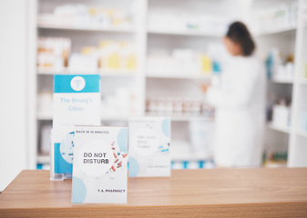 Image showing Employee break, pharmacy sign and shop poster of an busy retail board in healthcare store. Medical, wellness and doctor practice with a do not disturb placard and billboard on worker desk at clinic