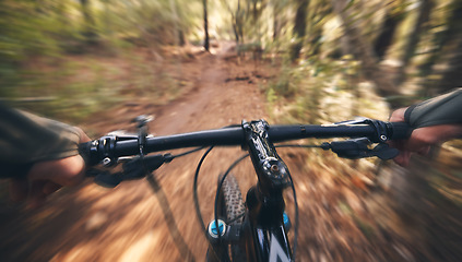 Image showing POV, mountain bike and person cycling in forest, park and path for adventure, speed and motion blur. Closeup perspective of bicycle handle, athlete and outdoor action in nature, off road and sports