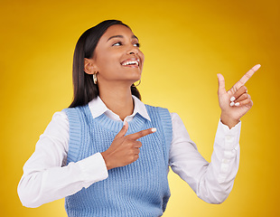 Image showing Woman, portrait and gun fingers in a studio pointing with emoji hand gesture with a smile. Happiness, business female and happy youth with proud and cool hands sign in isolated yellow background