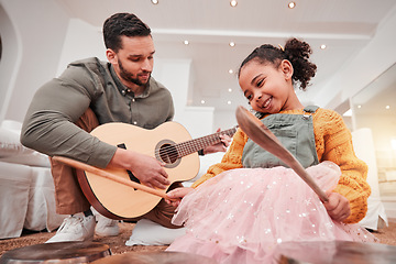 Image showing Family, children or fantasy band with a father and daughter playing music together on instruments at home. Kids, love or bonding with a man and girl child having fun in the living room of their house