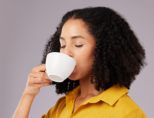 Image showing Calm woman, coffee and drinking in studio, backdrop and background for warm beverage, latte and taste of espresso. Female model enjoying cup of tea, cappuccino and good mood for break, relax or peace