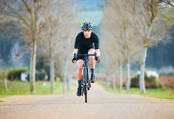 Image showing Cycling, fitness and travel with woman in park path for training, workout and health. Exercise, race and freedom with female cyclist riding on bike in nature for adventure, journey and transport