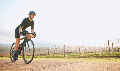 Image showing Cycling, fitness and mockup with woman in park for training, workout and cardio health. Exercise, travel and freedom with female cyclist riding on bike in nature for adventure, journey and transport